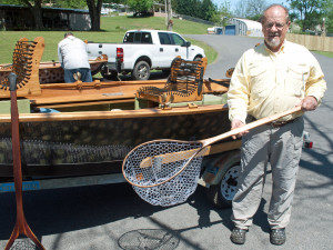 Nes Levotch with a net of his own design, in front of a boat of his own design. (Photo by Scott Robertson)