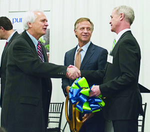 Frostad receives best wishes from Tennessee Lieutenant Governor Ron Ramsey as Governor Bill Haslam looks on immediately following the Jan. 29 ribbon-cutting.