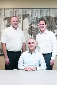 Plant Manager Roger Calloway and CFO Ed Feaster flank CEO Jean Luc Koch at Microporous corporate headquarters. Photo by Tara Hodges, Sweet Snaps Photography.
