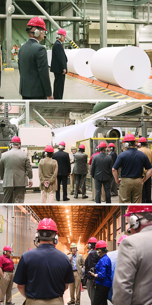 Roger Smith, paper machine department manager leads Congressman Phil Roe, Mayor John Clark and other dignitaries on a tour of the Kingsport mill.