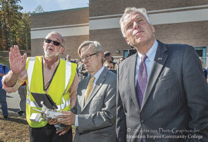 Virginia Governor Terry McAuliffe (right) looks on as Coeburn instructs Appalachian Regional Commission Chair Earl Gohl on the finer points of drone piloting. Photo courtesy Mountain Empire Community College